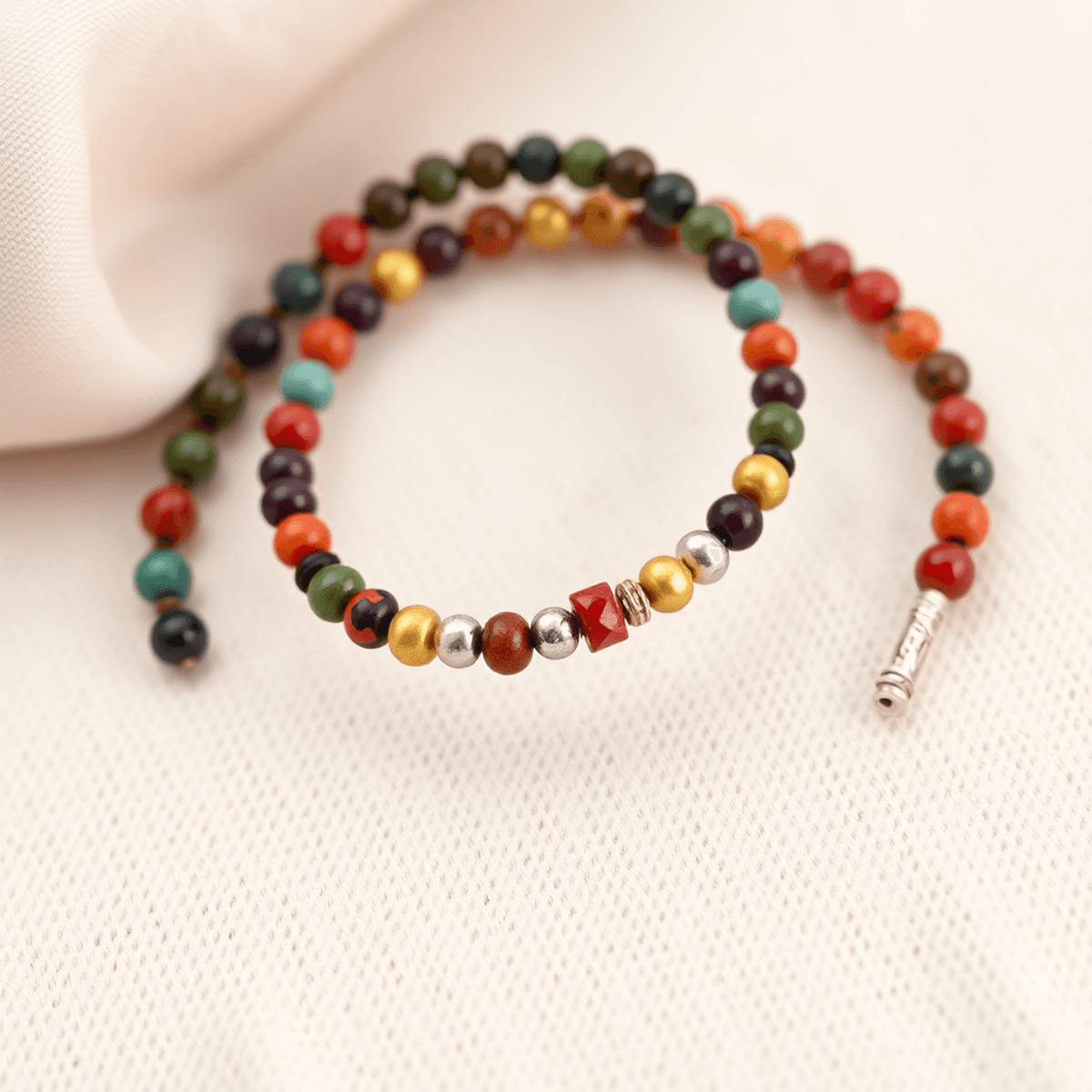 A pair of stylish couple bracelets, one with colorful beads and the other in sleek metal, displayed on a soft, neutral background, symbolizing love and connecti