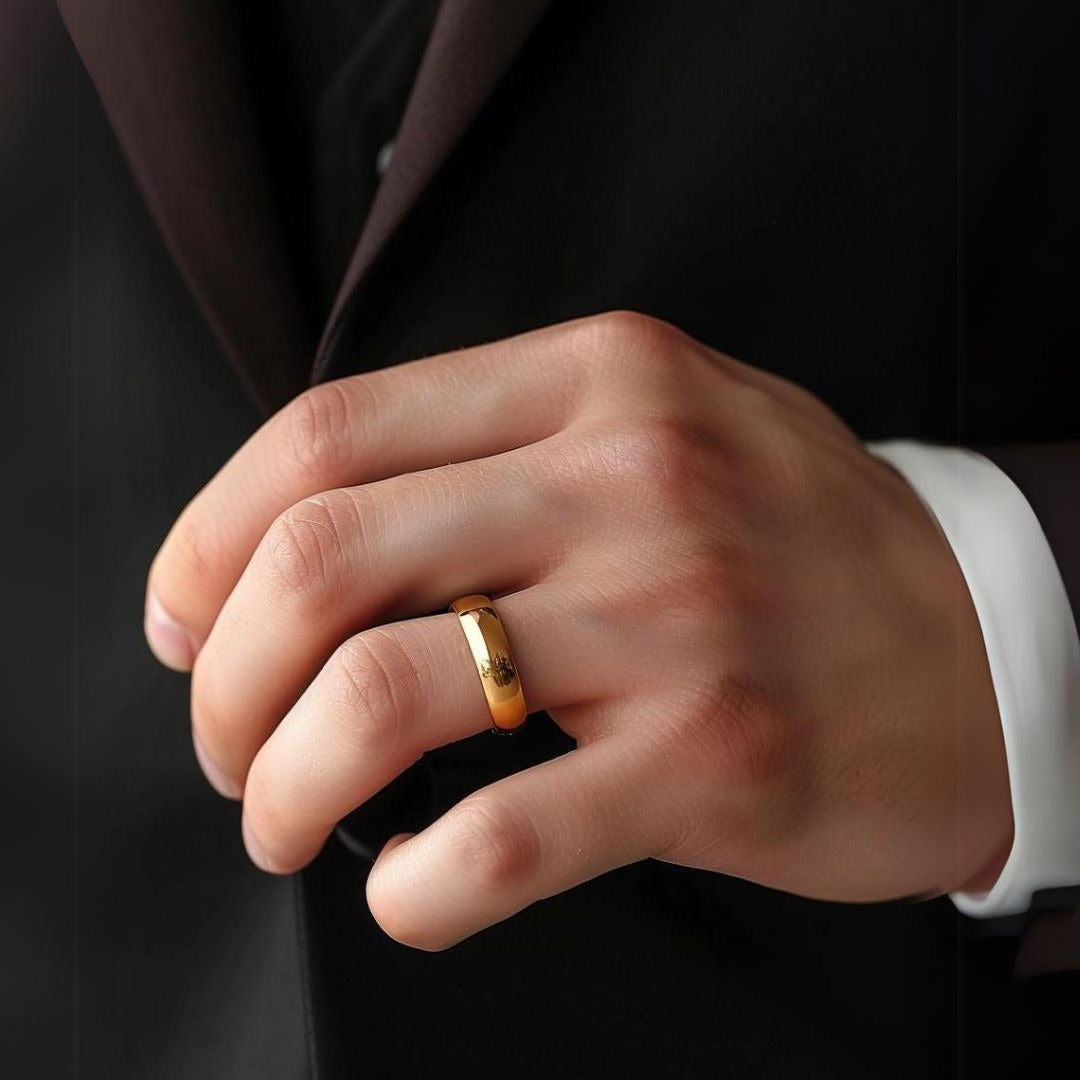 A close-up of a stunning gold men's ring on a soft velvet surface, accented by a small bouquet and a wedding band, highlighting the ring's intricate details and