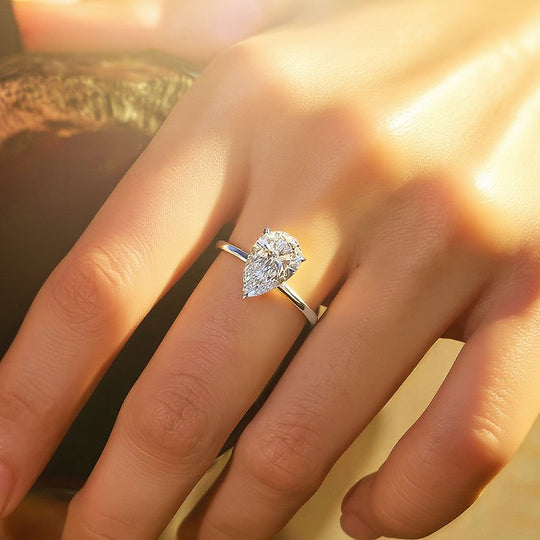 Prm7128: The Moissanite Pear Perfection Solitaire Ring