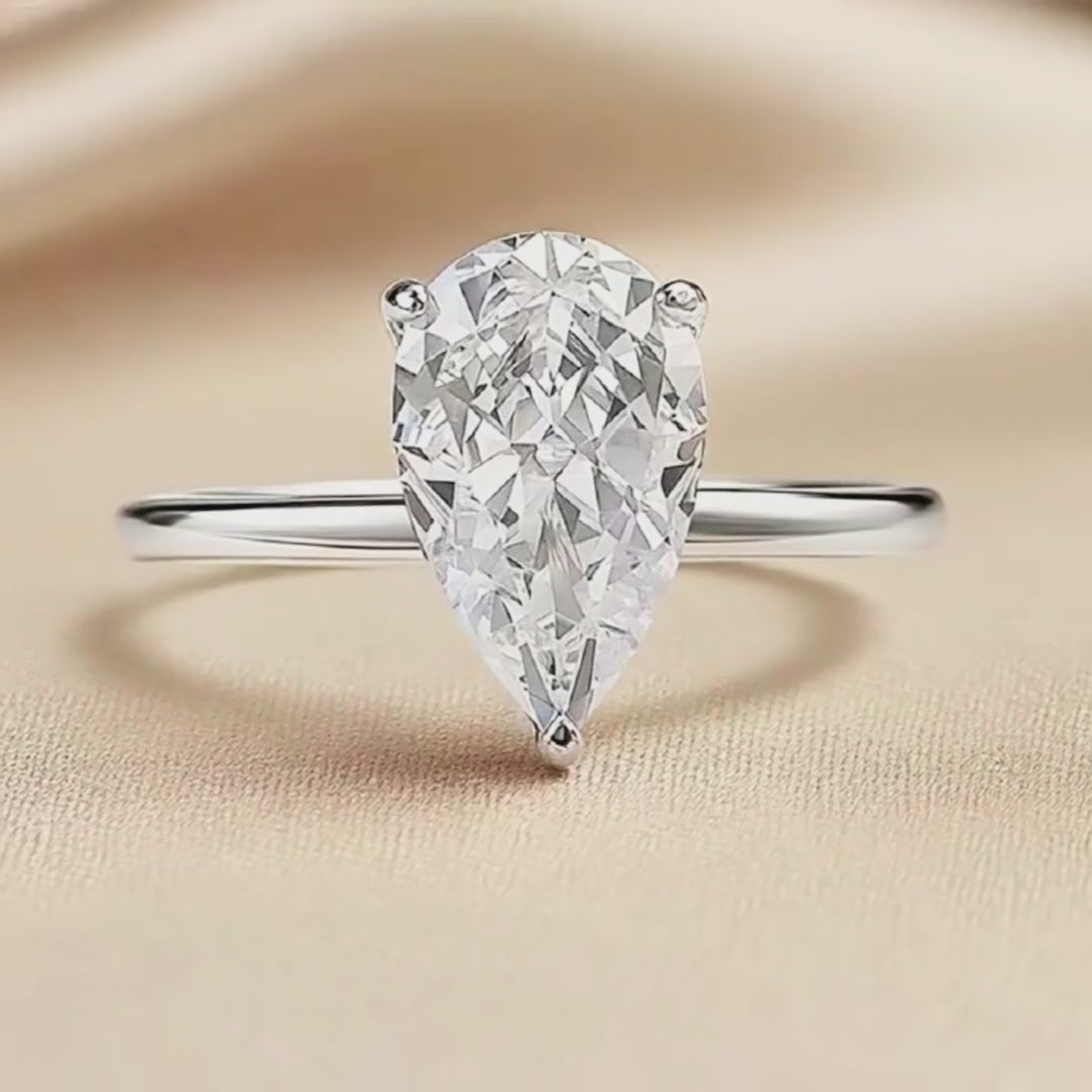 Prm7128: The Moissanite Pear Perfection Solitaire Ring