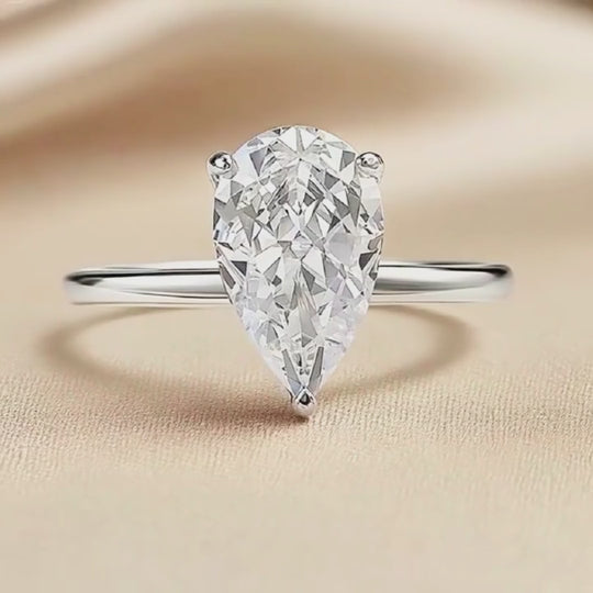 Prm7128: The Moissanite Pear Perfection Solitaire Ring